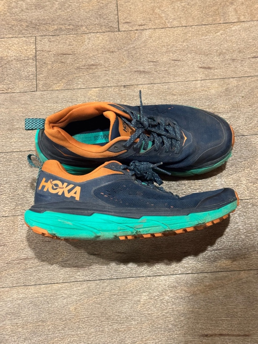 Hoka Navy and Teal Trail Running Shoes with Orange Trim